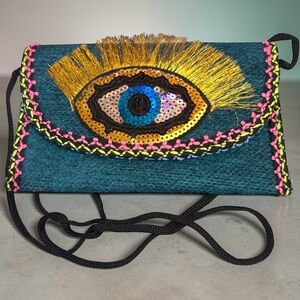 Handwoven Evil Eye Crossbody Bag.
New.